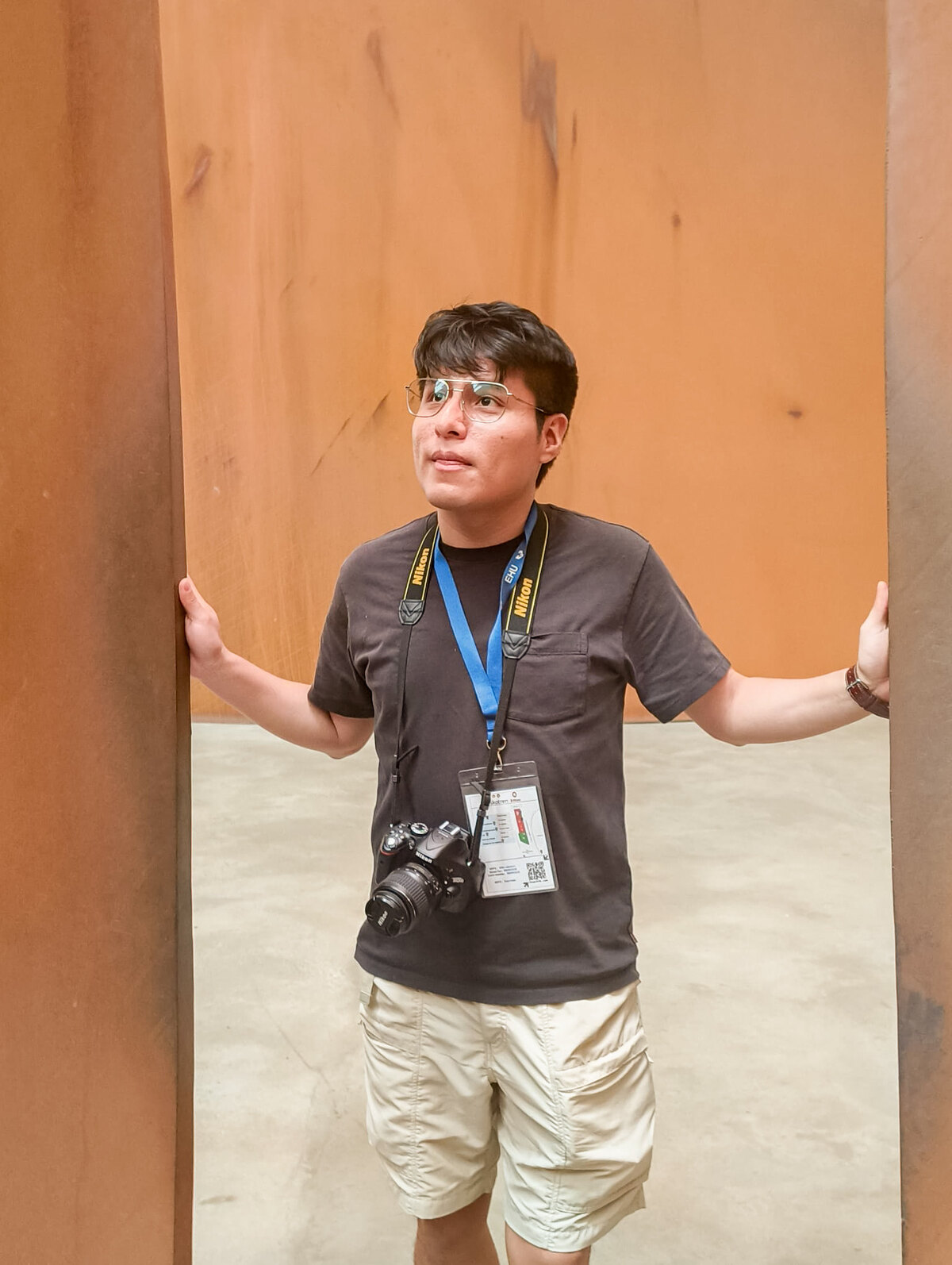 Sergio Zavaleta standing between architectural steel panels during the 2026 CEA symposium in Bilbao.